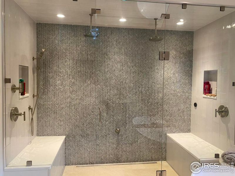 Steam shower with custom tile and multiple shower heads