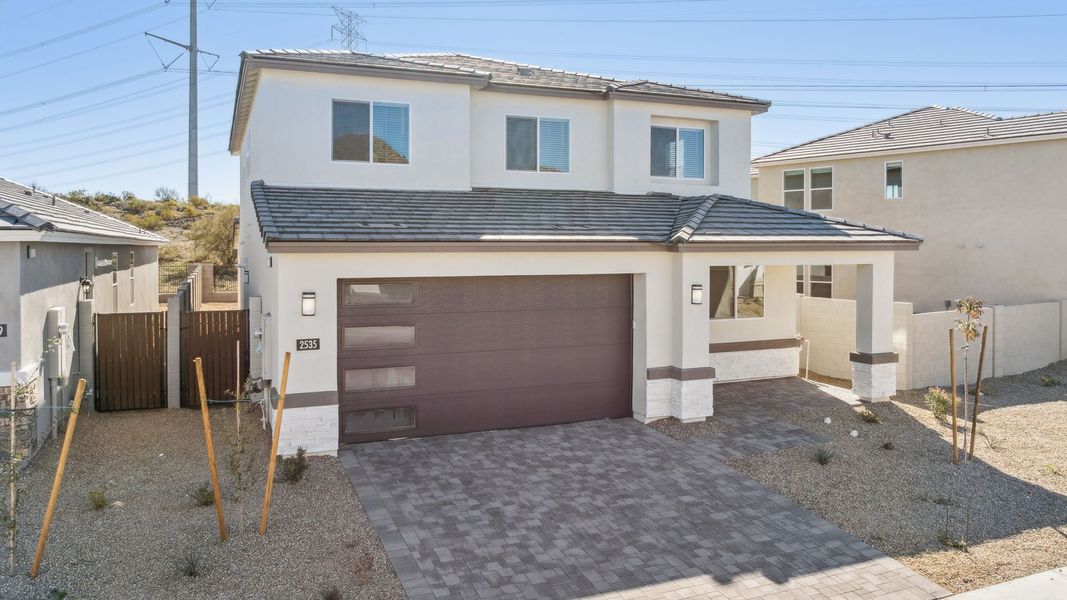 Representative exterior photo of a completed home built from the Crow by D.R. Horton in The Ridge at Stone Butte, Phoenix, AZ (Image 27).