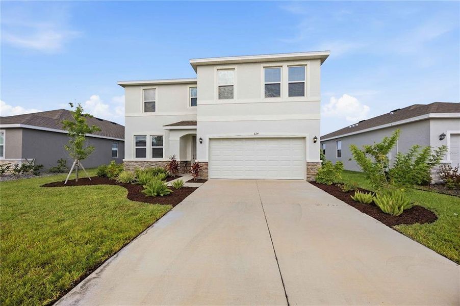 Front exterior of a new home in Coddington, Bradenton, FL, highlighting curb appeal (Image 27).
