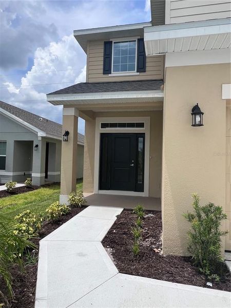 Front exterior of a new home in Harmony Central, Harmony, FL, highlighting curb appeal (Image 8). Front exterior of a new home in Harmony Central, Harmony, FL, highlighting curb appeal (Image 8).