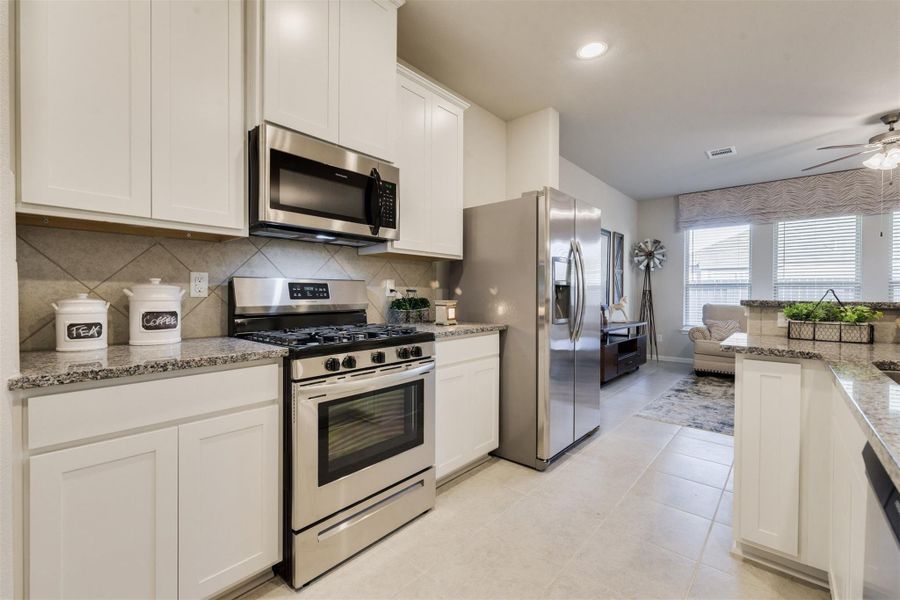 Furnished interior view inside a new home in Sunterra, Katy (Image 14).