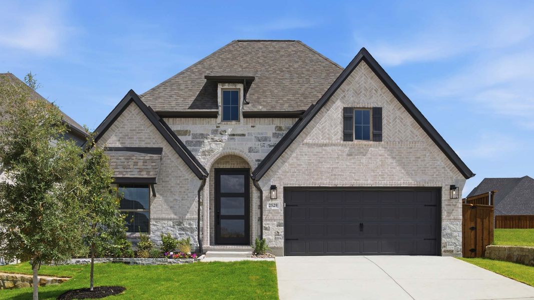 Front exterior of a new home in Walsh, Fort Worth, TX, highlighting curb appeal (Image 1). Front exterior of a new home in Walsh, Fort Worth, TX, highlighting curb appeal (Image 1).
