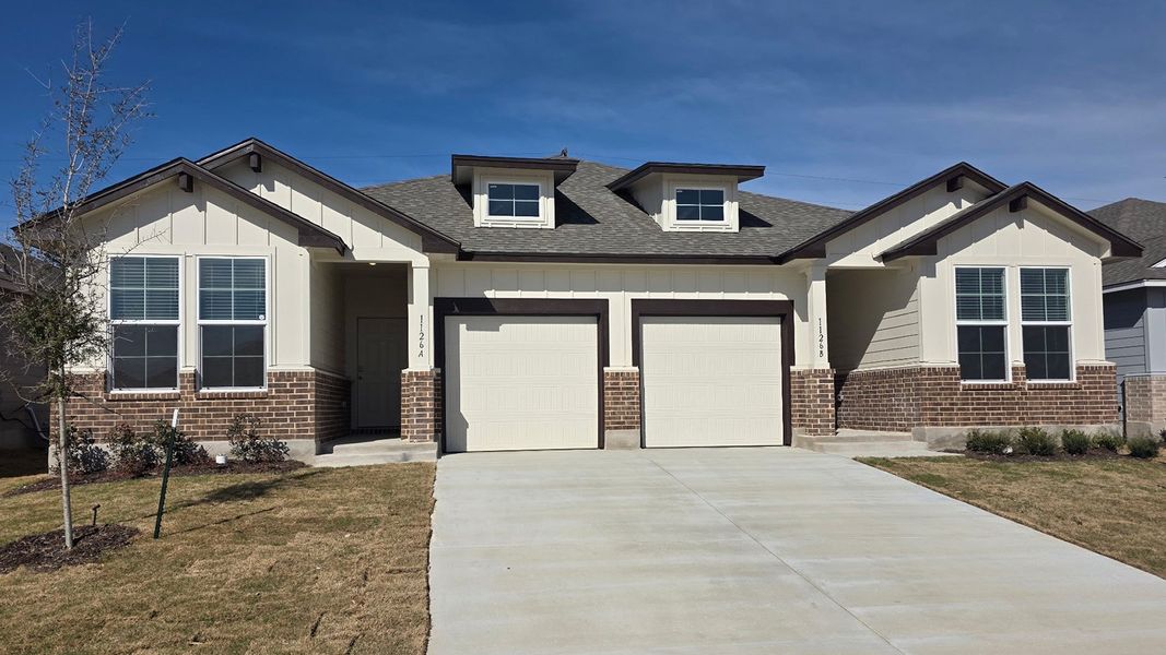 Front exterior of a new home in The Terrace Duplexes, Temple, TX, highlighting curb appeal (Image 1). Front exterior of a new home in The Terrace Duplexes, Temple, TX, highlighting curb appeal (Image 1).