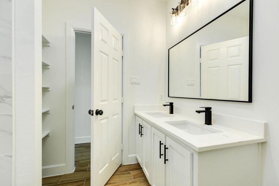 Double vanities in the 2nd bathroom located between both secondary bedrooms