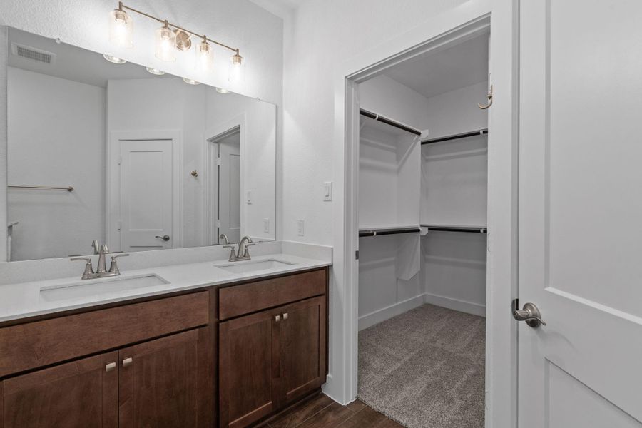 Furnished interior view inside a new home in Meridiana, Iowa Colony (Image 6).