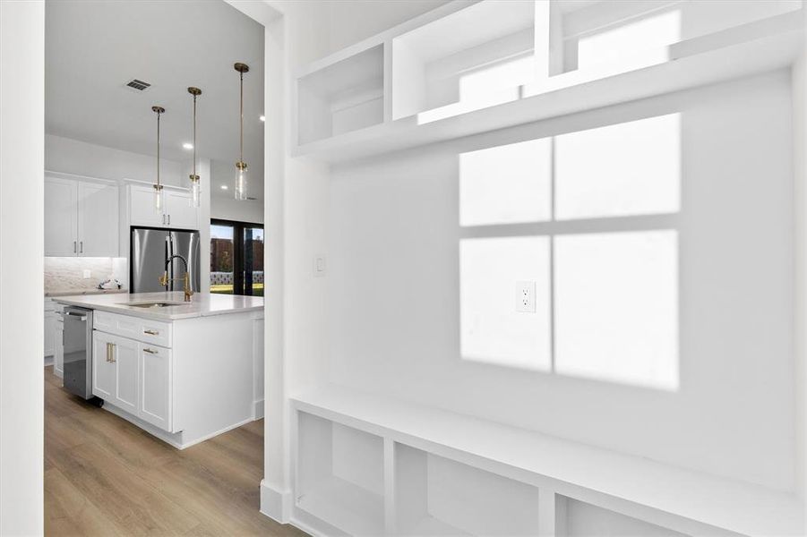 Mudroom off of kitchen....leads to the garage! This is a SEPARATE room from the pantry! Love this space to contain some of the craziness from work, school, etc.