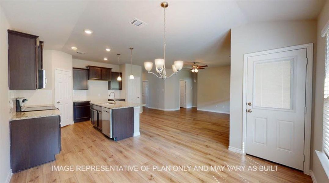 Kitchen featuring a sink, dark brown cabinets, a chandelier, dishwasher, and an island with sink Kitchen featuring a sink, dark brown cabinets, a chandelier, dishwasher, and an island with sink