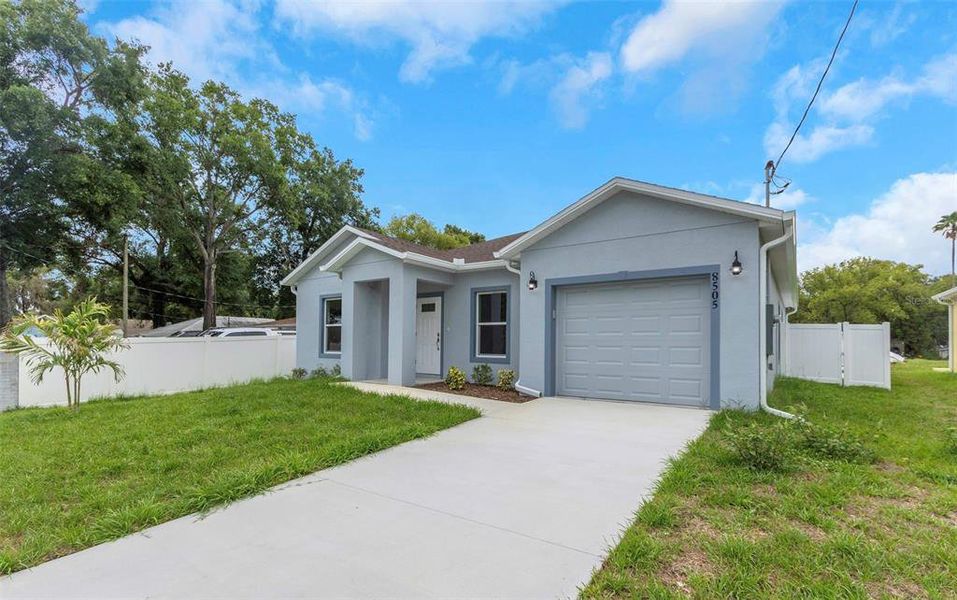 Front exterior of a new home in , Tampa, FL, highlighting curb appeal (Image 24).