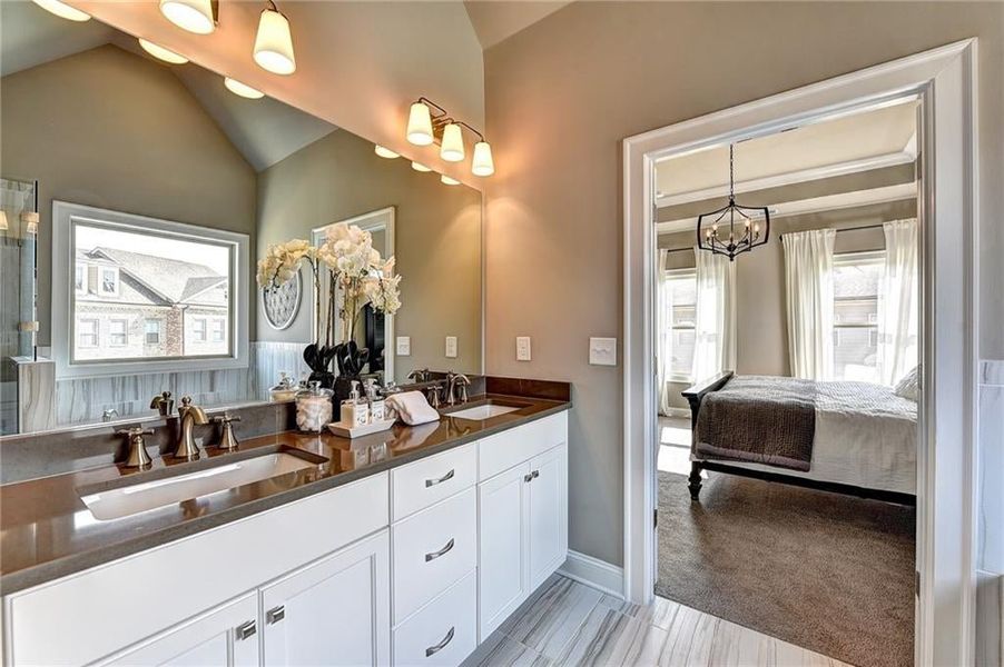 Bathroom with tile flooring, l double sink,, and oversized vanity    ***Photos NOT OF ACTUAL Home but for representation Purposes only. Home is UNDER Construction- Photos are of a previously built Model House Freemont plan by The Providence Group