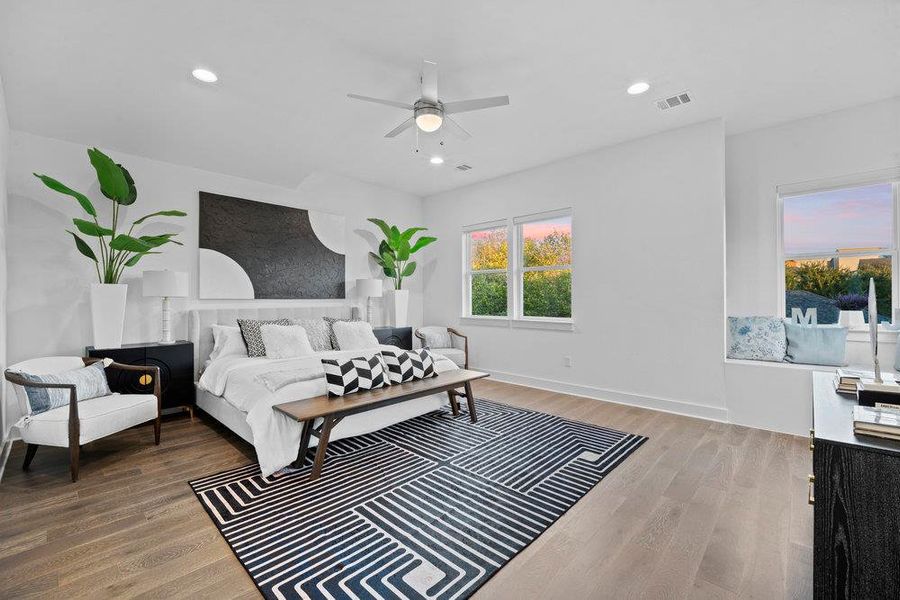 Bedroom featuring light wood-style floors, ceiling fan, and recessed lighting