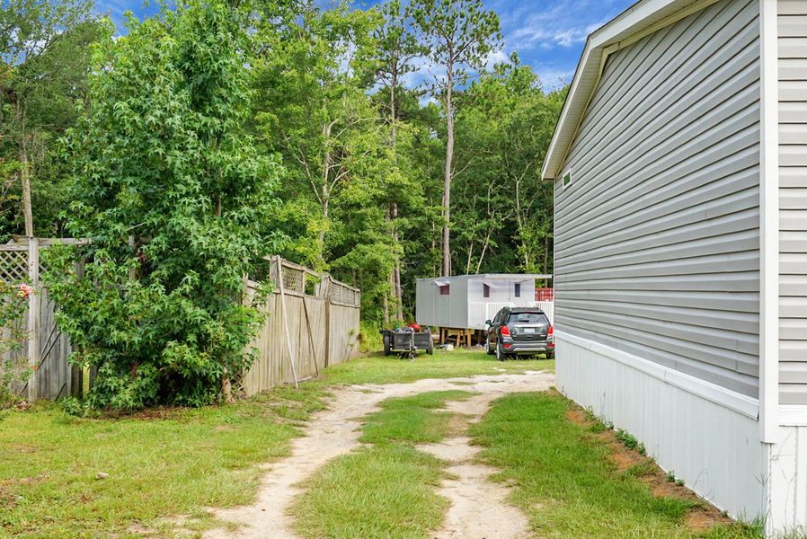 Front exterior of a new home in , Bonneau, SC, highlighting curb appeal (Image 22).