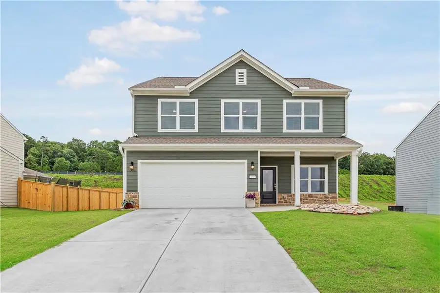 Front exterior of a new home in , Calhoun, GA, highlighting curb appeal (Image 1). Front exterior of a new home in , Calhoun, GA, highlighting curb appeal (Image 1).