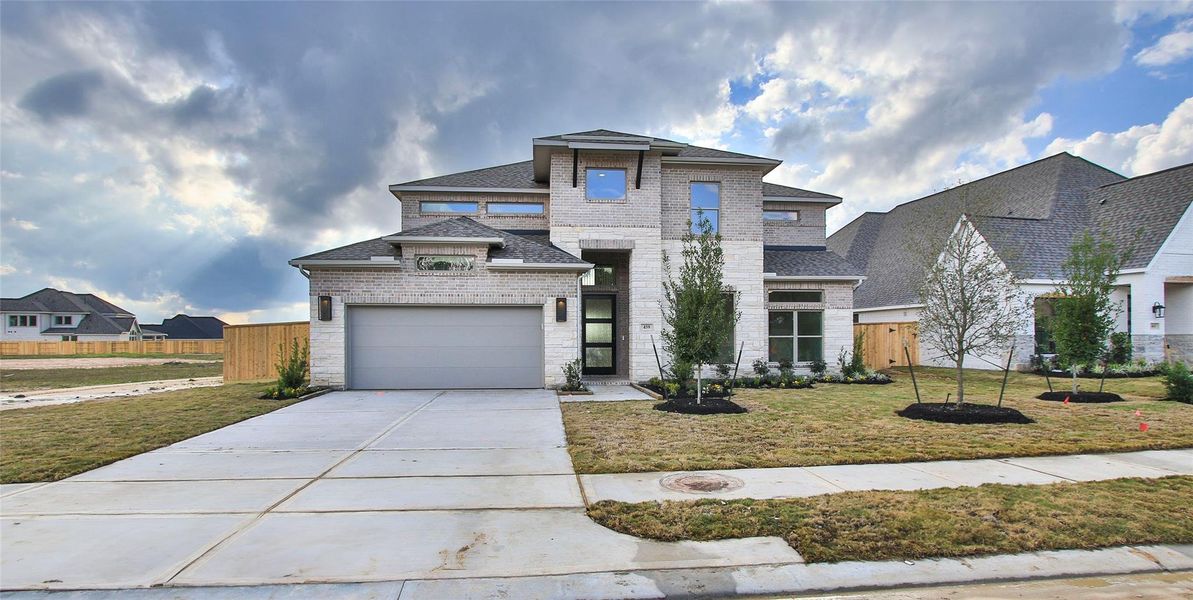 Front exterior of a new home in Briarley 60', Montgomery, TX, highlighting curb appeal (Image 13).