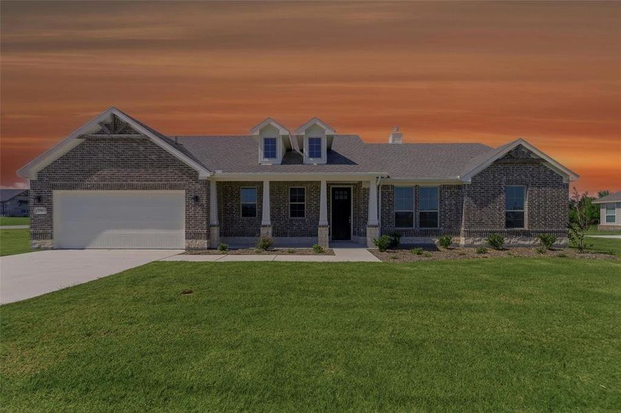 Brick exterior residence with a covered front porch and dormer windows