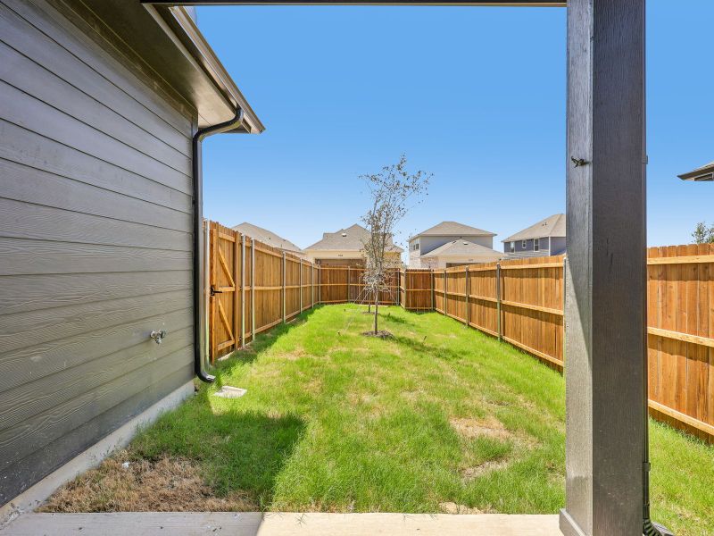 Exterior details and patio area of a home in Cibolo Hills West - Spring Series, Fort Worth (Image 17).