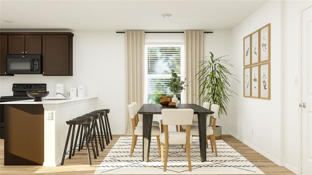 Dining space with light wood-type flooring and baseboards Dining space with light wood-type flooring and baseboards