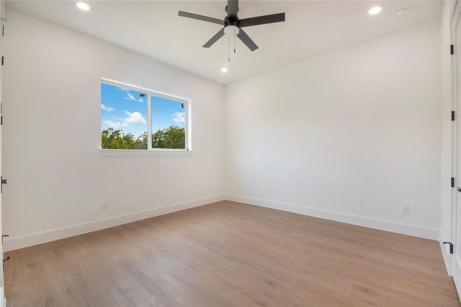 Spare room with recessed lighting, light wood finished floors, and a ceiling fan