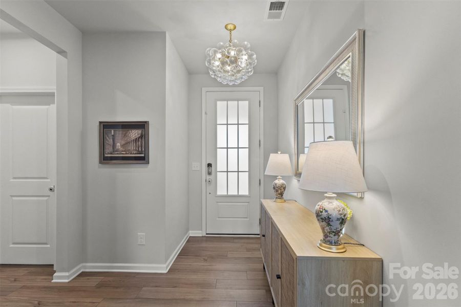 Foyer with eye-catching upgraded light. Foyer with eye-catching upgraded light.