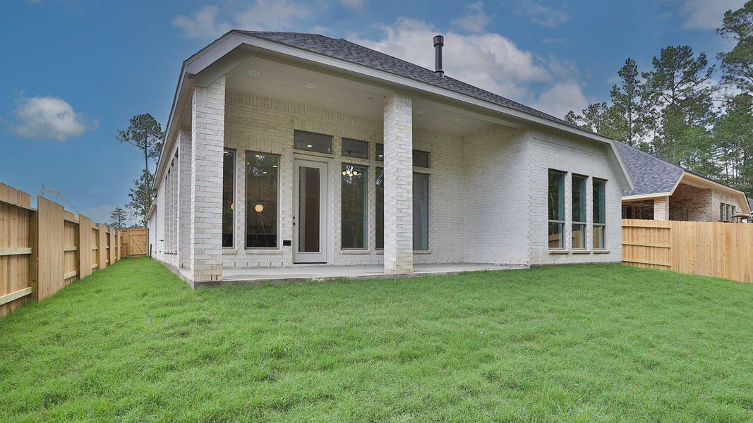 Exterior details and patio area of a home in Woodhavyn, Magnolia (Image 2). Exterior details and patio area of a home in Woodhavyn, Magnolia (Image 2).