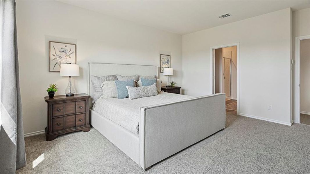 Bedroom featuring light-colored walls and grey carpet flooring