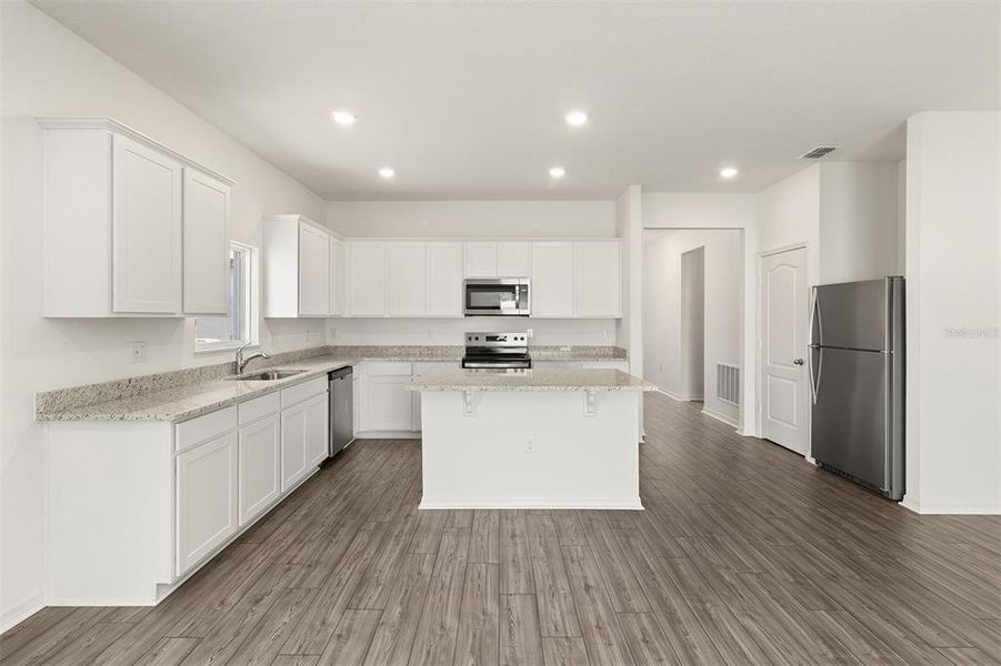 Furnished interior view inside a new home in Peach Crossings, Winter Haven (Image 5).