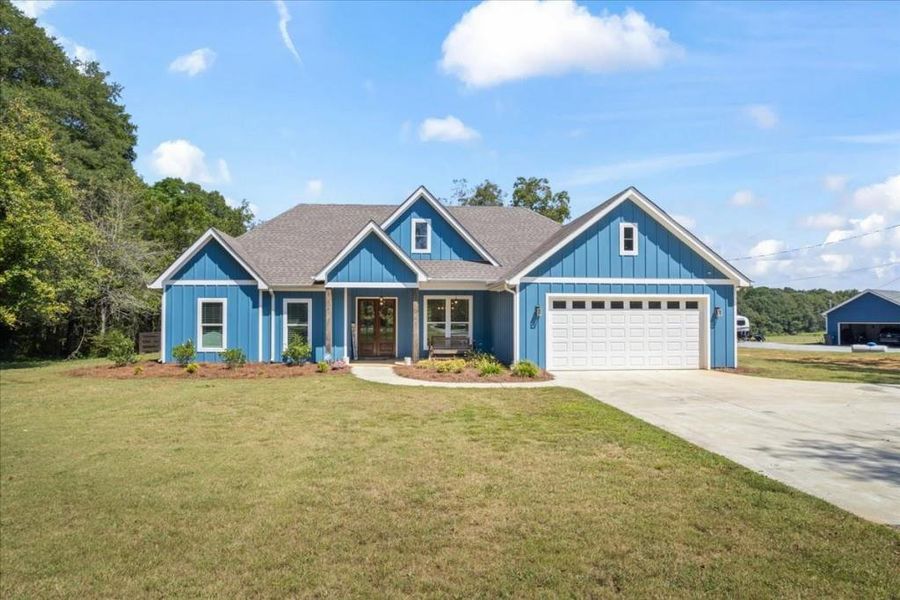 Front exterior of a new home in , Newborn, GA, highlighting curb appeal (Image 21).