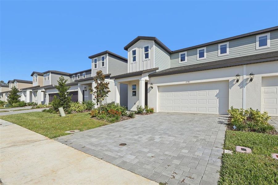 Front exterior of a new home in , Clermont, FL, highlighting curb appeal (Image 2). Front exterior of a new home in , Clermont, FL, highlighting curb appeal (Image 2).
