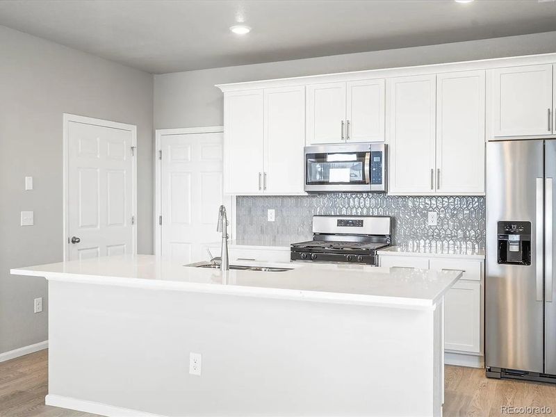 Furnished interior view inside a new home in Painted Prairie, Aurora (Image 5).