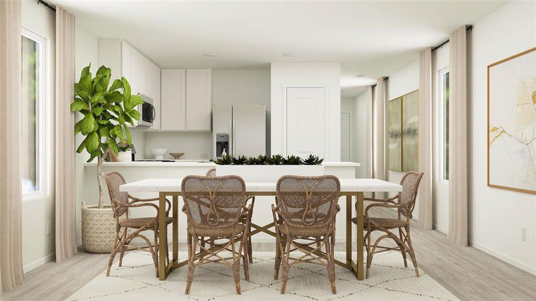 Dining space featuring light hardwood / wood-style flooring