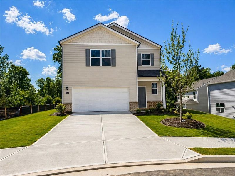 Front exterior of a new home in Sherwood Manor, College Park, GA, highlighting curb appeal (Image 1). Front exterior of a new home in Sherwood Manor, College Park, GA, highlighting curb appeal (Image 1).