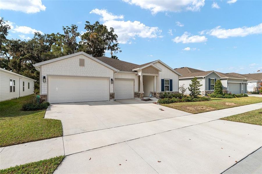 Front exterior of a new home in Finley Woods, Gainesville, FL, highlighting curb appeal (Image 25). Front exterior of a new home in Finley Woods, Gainesville, FL, highlighting curb appeal (Image 25).