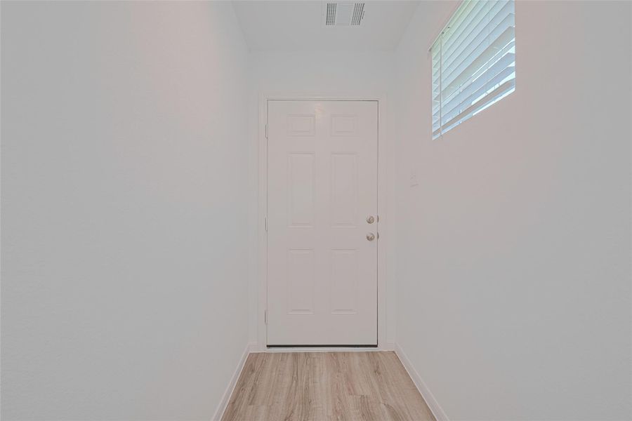 Spacious, unfurnished interior of a new home in Sunterra, Katy (Image 30).