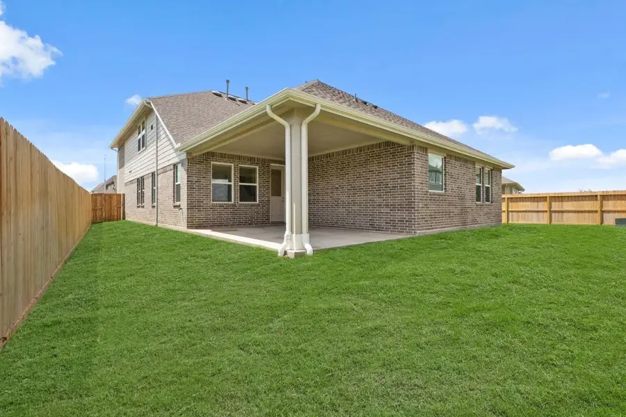 Exterior details and patio area of a home in Westland Ranch - 70' Homesites, League City (Image 2). Exterior details and patio area of a home in Westland Ranch - 70' Homesites, League City (Image 2).