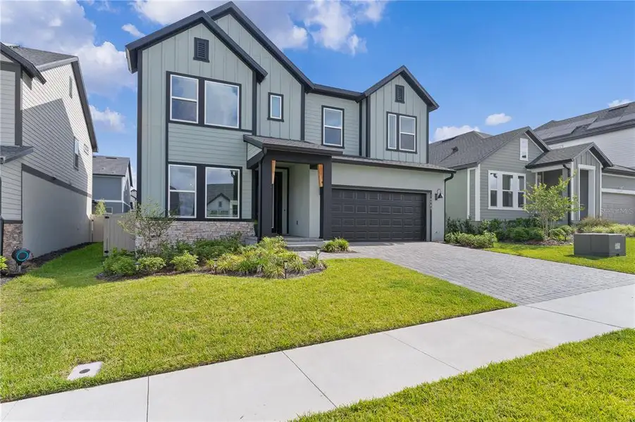 Front exterior of a new home in , Clermont, FL, highlighting curb appeal (Image 21).