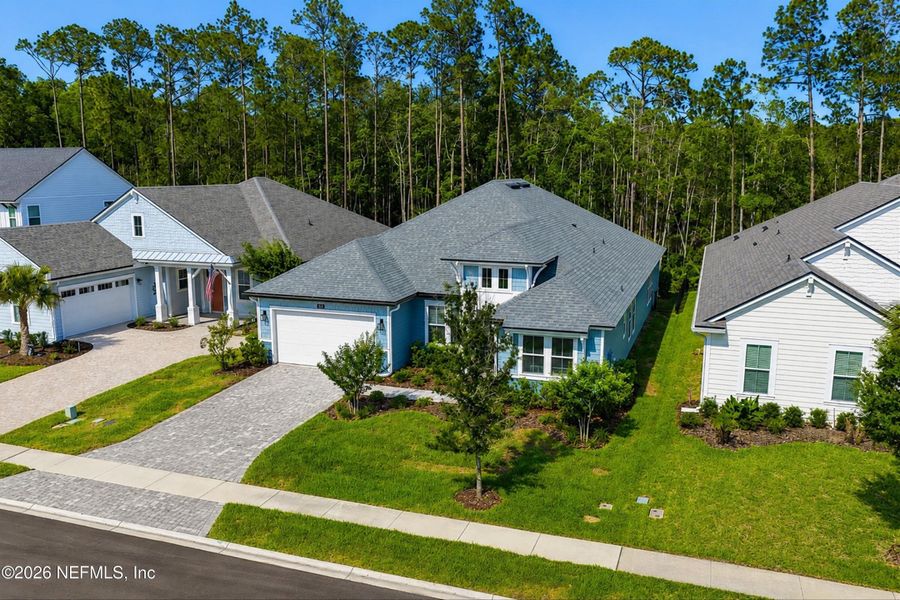 Front exterior of a new home in Palm Crest at Seabrook, Ponte Vedra, FL, highlighting curb appeal (Image 25).