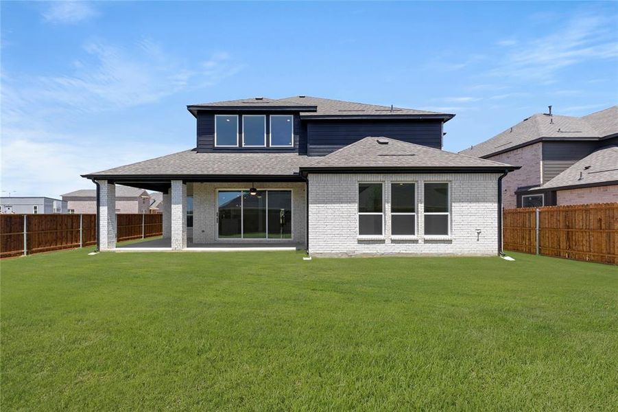 Front exterior of a new home in Valencia on The Lake, Little Elm, TX, highlighting curb appeal (Image 21).