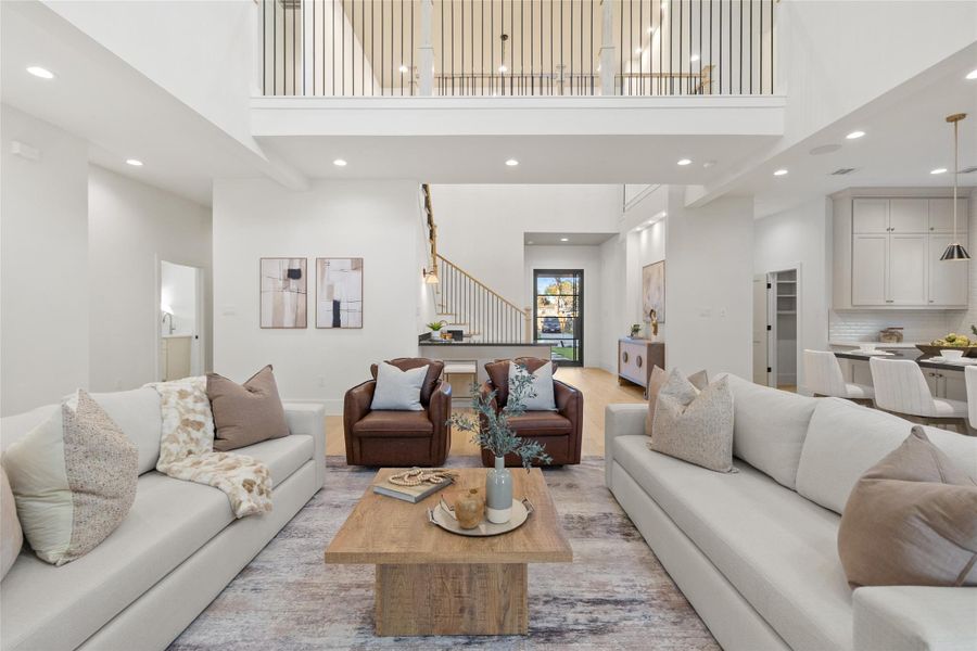 Your open-concept living area brings everyone together with ease. Wide plank flooring, soaring ceilings, and an airy layout create a natural flow between living, dining, and kitchen spaces, making it just as comfortable for quiet evenings as it is for hosting friends.