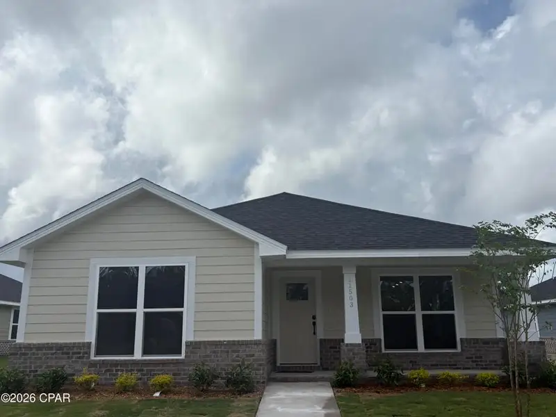Front exterior of a new home in East Bay, Panama City, FL, highlighting curb appeal (Image 1). Front exterior of a new home in East Bay, Panama City, FL, highlighting curb appeal (Image 1).