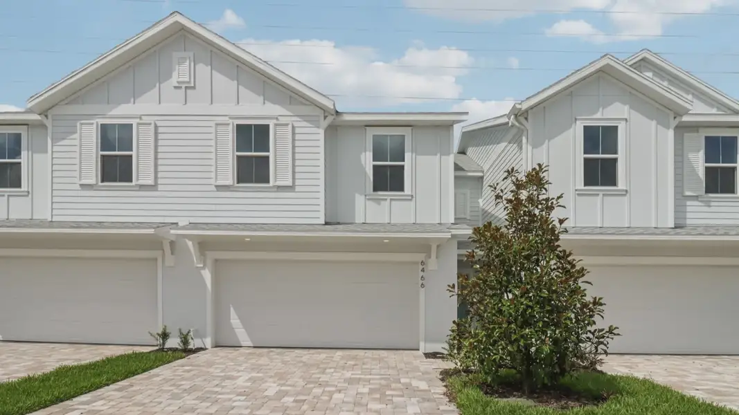 Front exterior of a new home in Cyrene at Harmony, St. Cloud, FL, highlighting curb appeal (Image 2).
