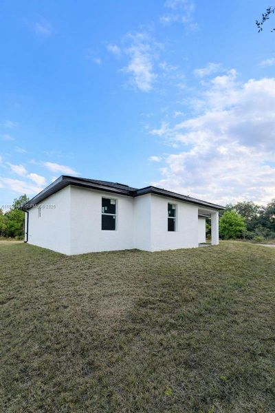 Exterior details and patio area of a home in , Lehigh Acres (Image 10).