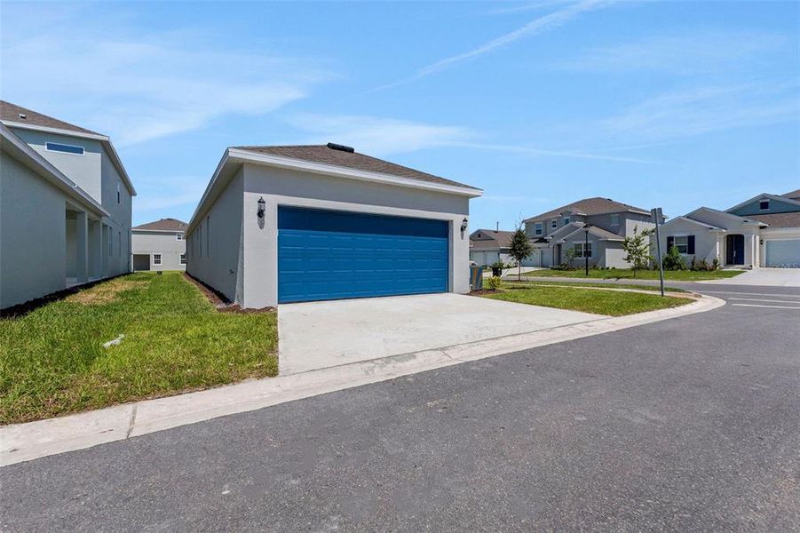 Front exterior of a new home in Crossroads at Kelly Park, Apopka, FL, highlighting curb appeal (Image 27).