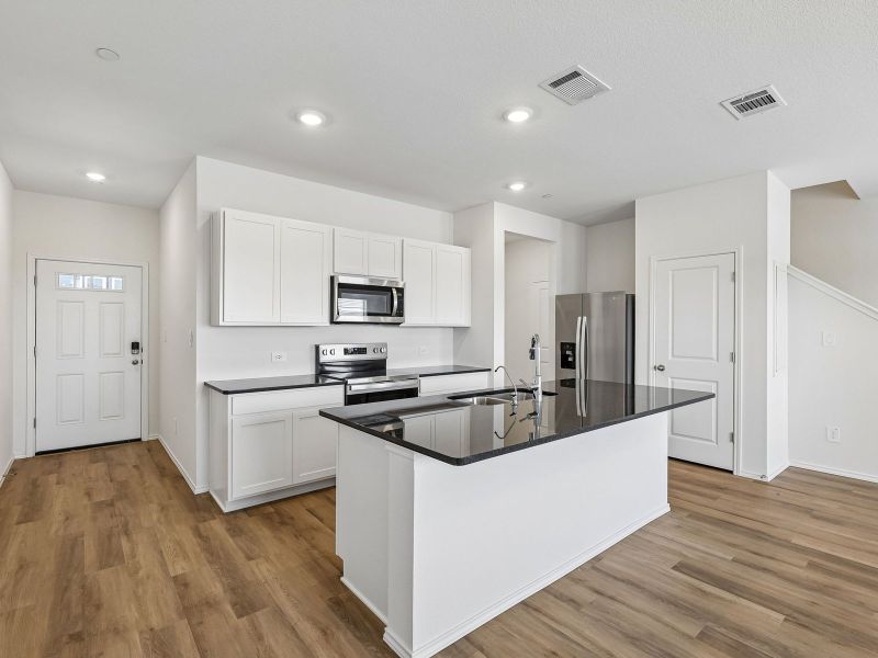 Furnished interior view inside a new home in Turner's Village, Buda (Image 3).