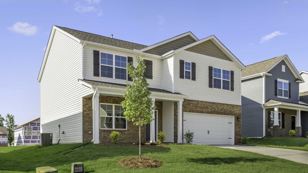 Front exterior of a new home in Cambridge Park, Mebane, NC, highlighting curb appeal (Image 2). Front exterior of a new home in Cambridge Park, Mebane, NC, highlighting curb appeal (Image 2).