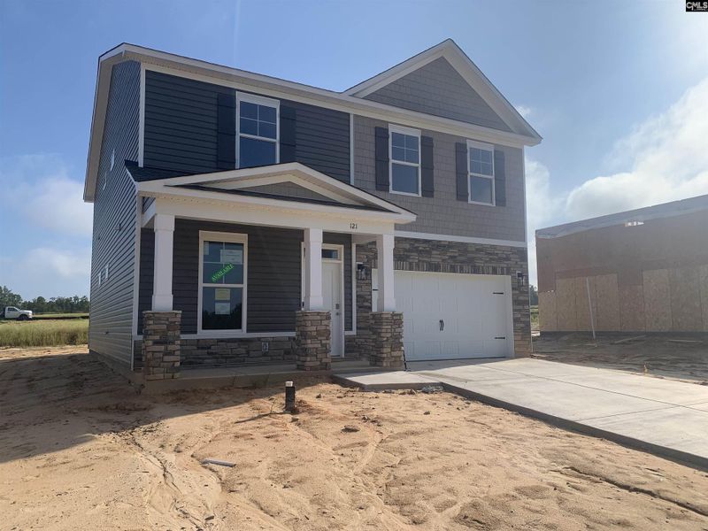 Front exterior of a new home in Peachtree Hills, Lexington, SC, highlighting curb appeal (Image 1).