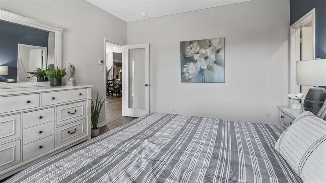 Bedroom with light gray walls and a contrasting accent wall