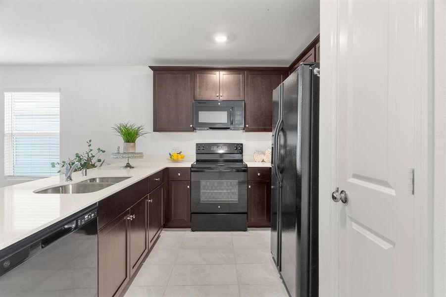 Kitchen with all Appliances, including Refrigerator and Pantry