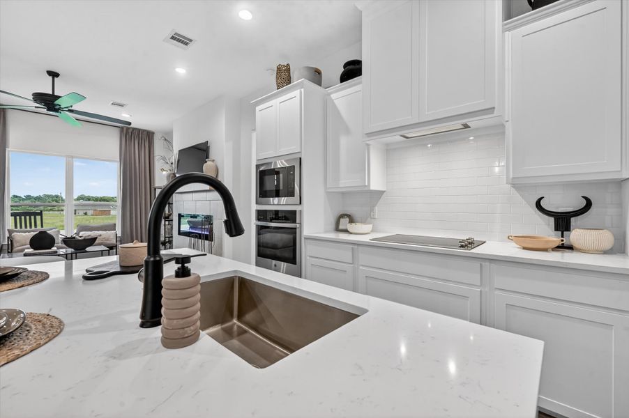 Representative furnished interior of a home built from the The Clover by Kenmark Homes in Zion Valley, Poolville (Image 13).
