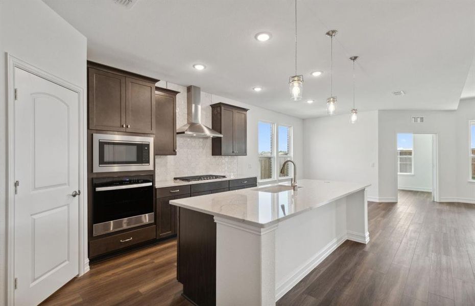 Bright kitchen with oversized island *real home pictured