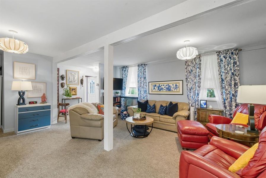 Living area featuring light colored carpet Living area featuring light colored carpet
