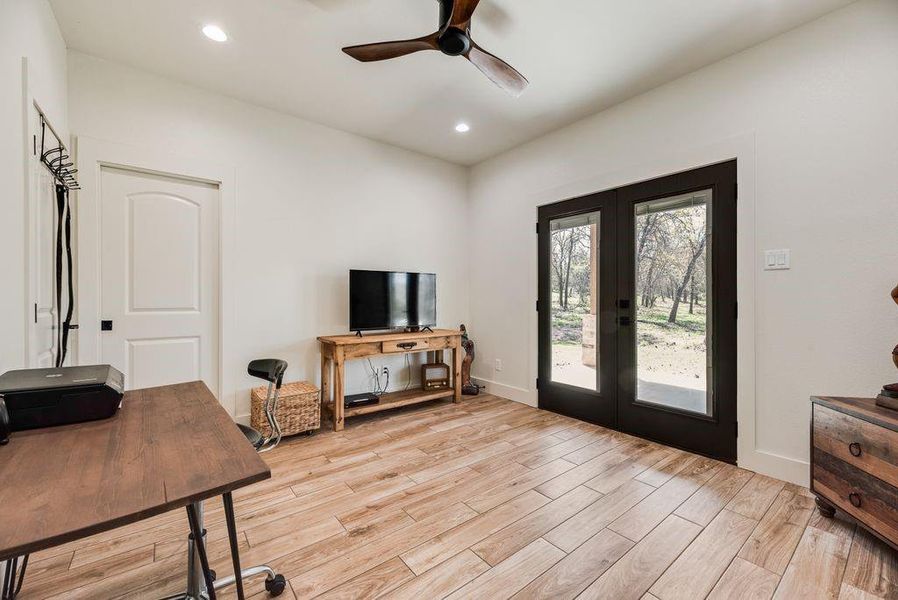 Large Secondary Bedroom being used as an office space. There is a door to the HUGE back covered porch in this room